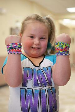 Photo of a happy girl with bracelets