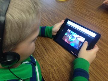 Boy viewing a video on a Ipad